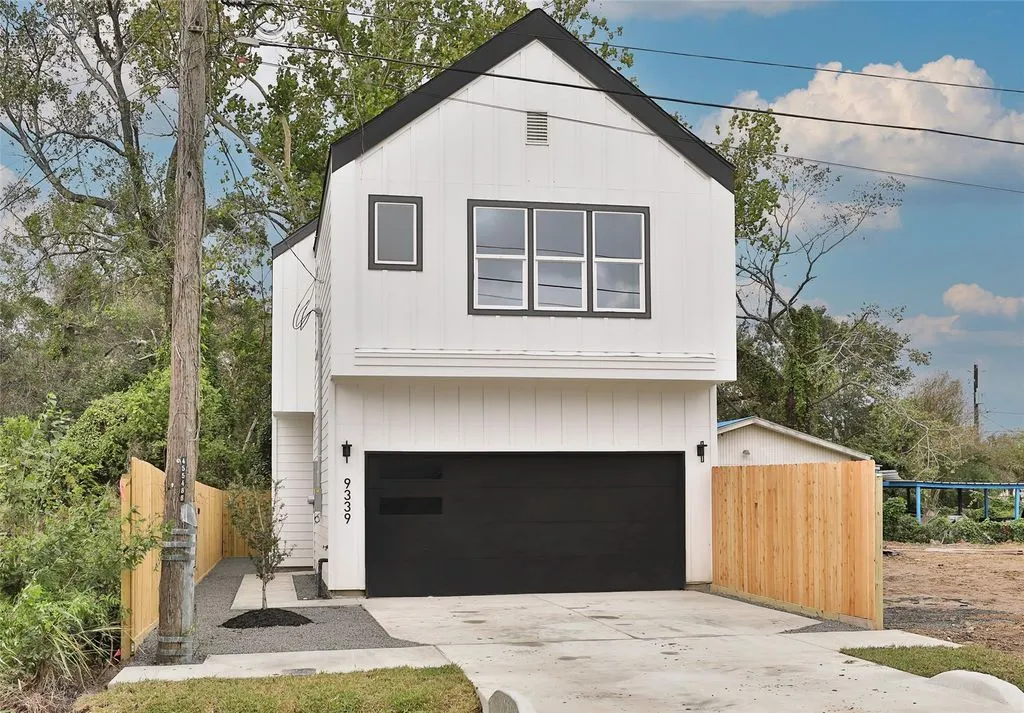 Completed white residential home from the Julianah Estates listing imagery